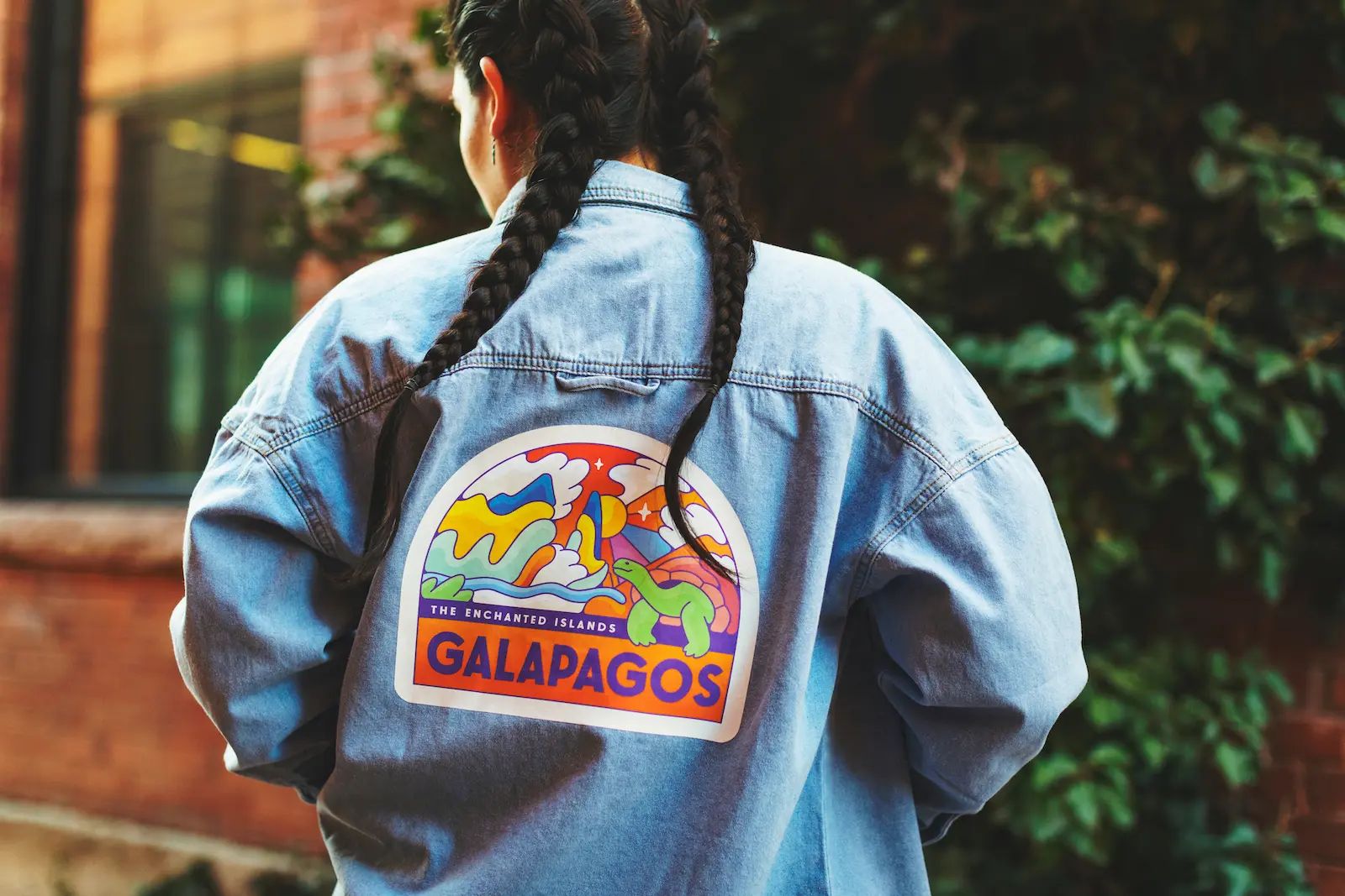 Colorful custom transfer applied to the back of a denim jacket