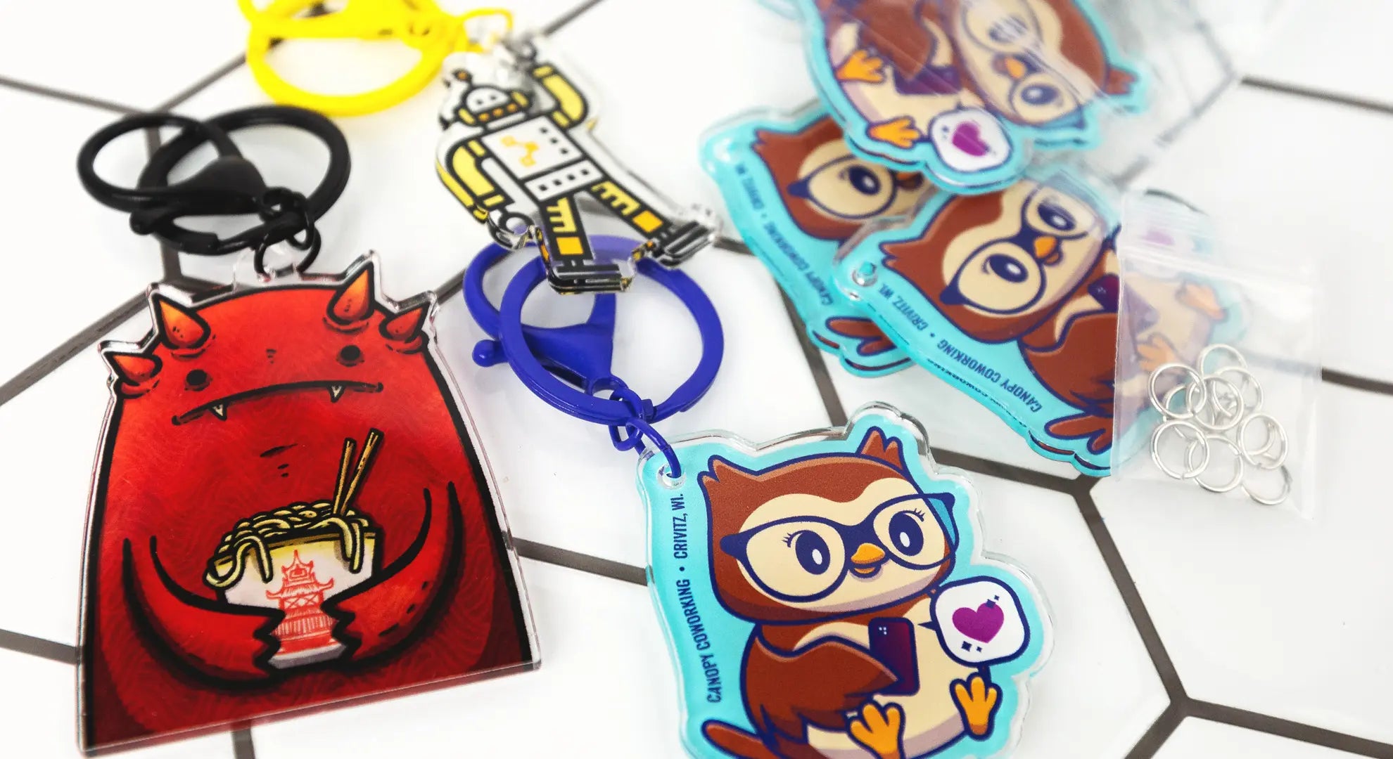 A collection of finished custom acrylic charms